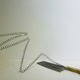 Illustration for article titled Intricate shadow silhouettes carved out of butcher's knife blades
